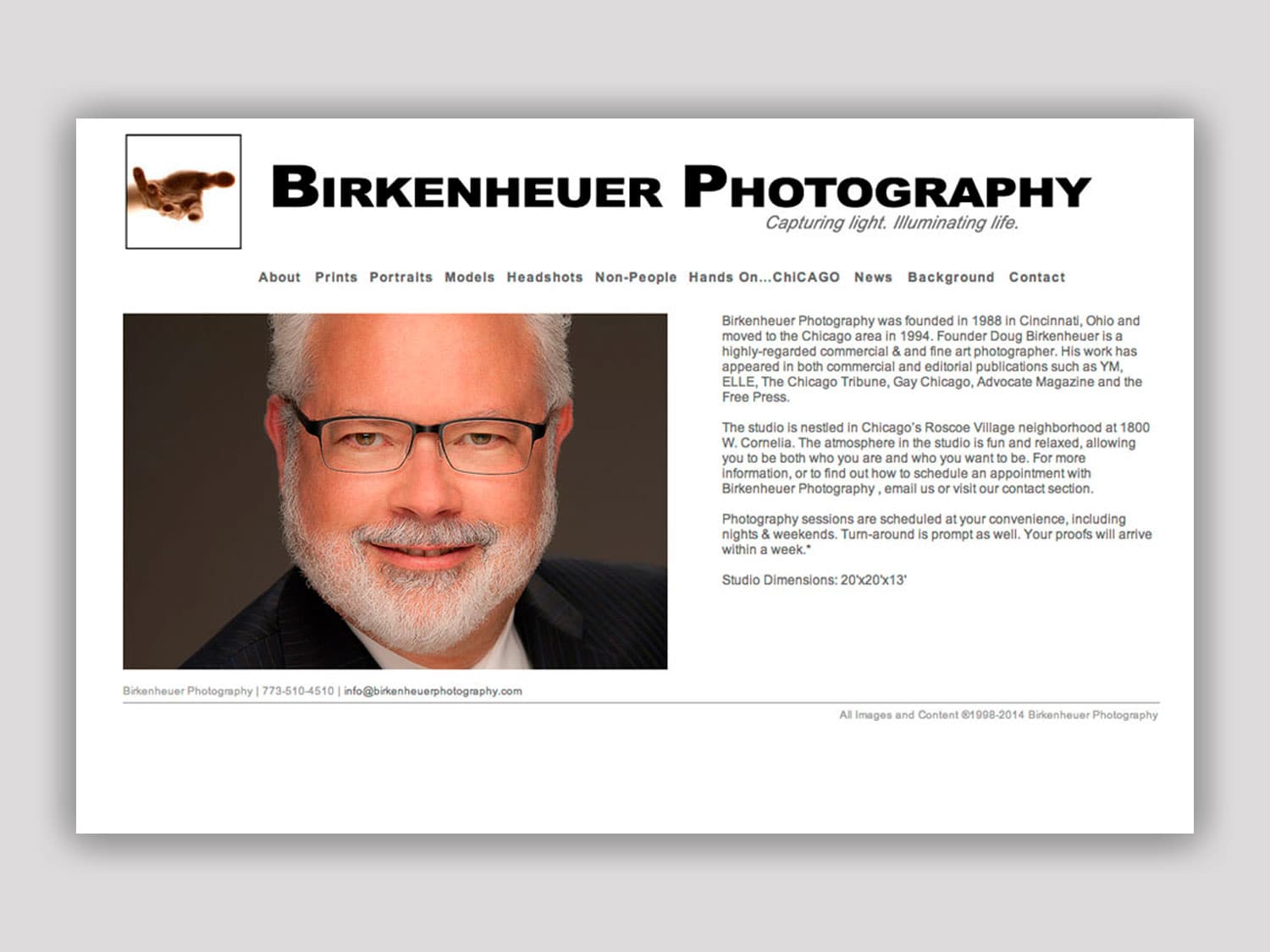 A screenshot of a website for a photographer in a clean white background, black text design shows a sample portrait image of a professional-looking, middle-aged man taken in a professional studio setting. Some copy is seen to the side below the title Birkenheuer Photography with the motto "Capturing light. Illuminating life."