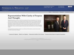 Stamos & Trucco website. A screenshot of a website showing a subtle blue navigation bar with the title Stamos & Trucco LLP in a stately font and shiny, silver appearance on the left and address information to the right. Some links in blue are seen in the bar and below that in the main section is illegible copy save for the page heading "Representation with clarity of purpose and thought" and to the right a photo of two men with grey hair and dark blue and grey, tailored suits standing in front of a desk