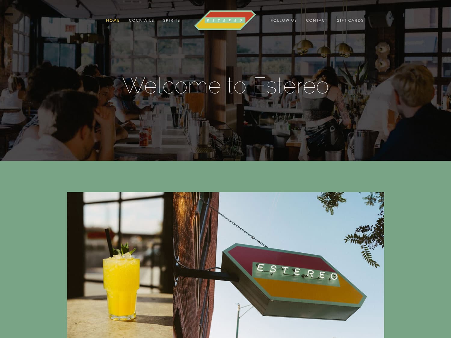 A screenshot of website for an urban drink lounge with a modern feel. The color scheme is a muted green background with yellow and orange accents. The masthead photo seen in the screen capture is of the main bar with patrons seated on either side talking while bartenders work in the middle. Below that is an image of a tropical-looking cocktail on photographed on a sunny day and the bar's exterior sign shown in another photo on the right