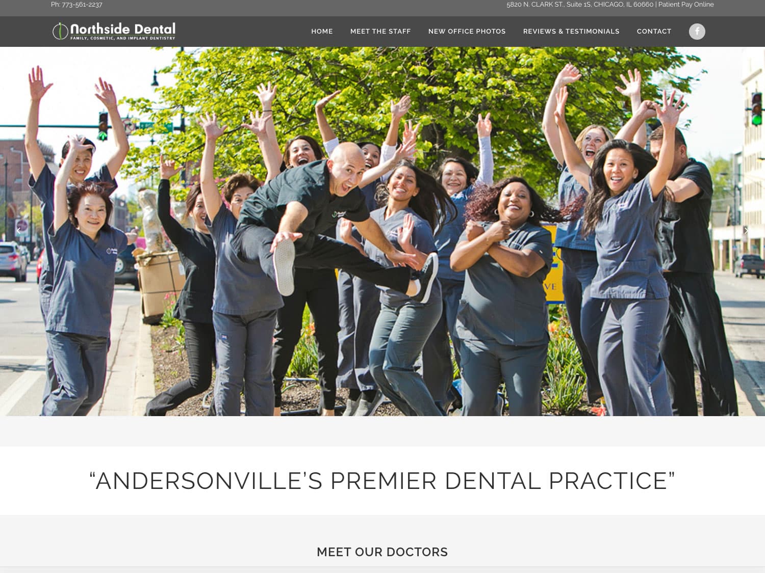 A screenshot of a website for a dental office shows a short navigation bar over a large photo of the dentistry's staff, all clad in blue-grey medical garb, smiling and jumping up in the air outdoors on a city street on a sunny day